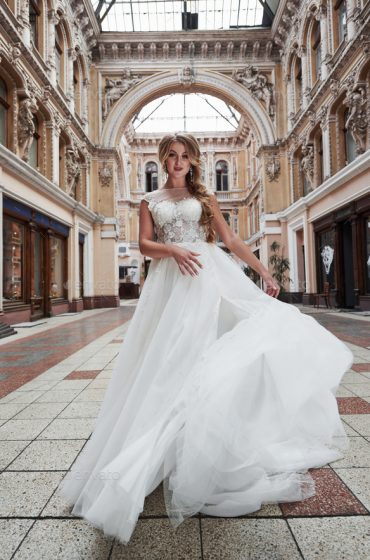 Beautiful delicate young woman, sexy bride in luxurious wedding dress.