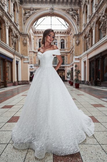 Beautiful delicate young woman, sexy bride in luxurious wedding dress.